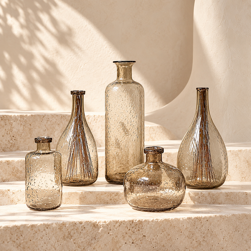 SOGNA smoked glass bud vase collection on limestone